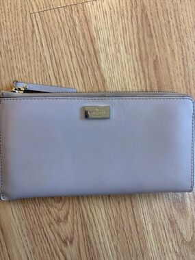 kate spade lavender leather zip-around wallet with gold plaque